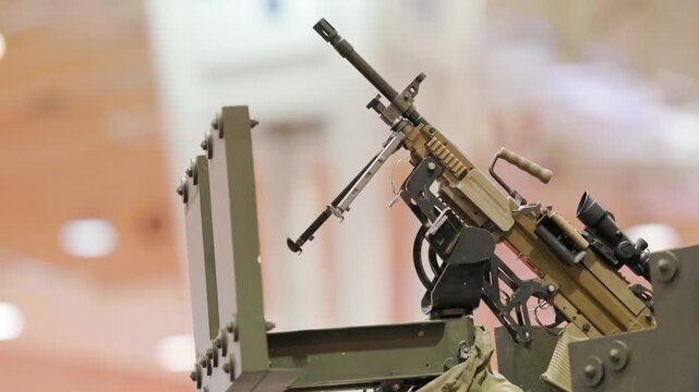 Heavy machine gun mounted on turret at defense exhibition