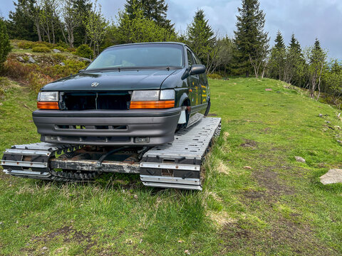 Swieradow-Zdroj, Poland, May 15, 2026: A snow-grooming vehicle (piste machine) waiting for the winter season