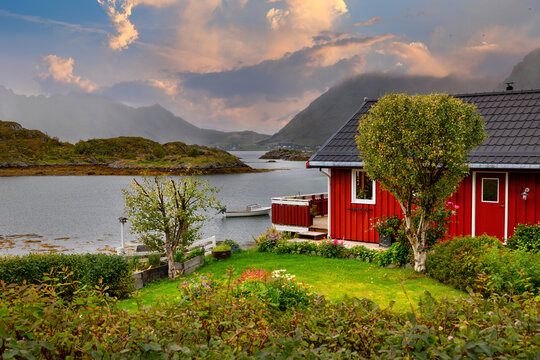 Red wooden house by the sea near Steine in the Lofoten Islands, Norway
