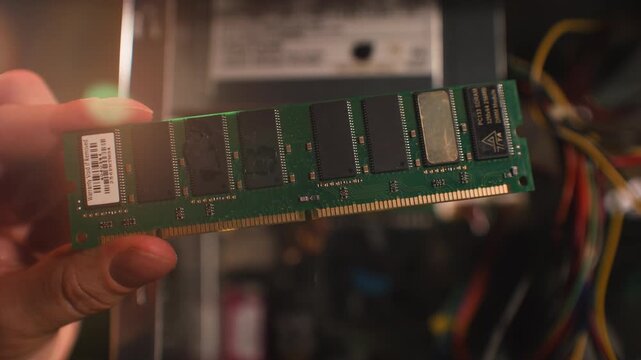 RAM memory module in hand, retro 90s DDR RAM stick with megabyte memory chips, vintage computer hardware upgrade inside old desktop PC
