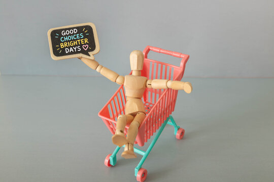 Good Choices Brighter Days Conscious Shopping and Positive Consumer Decisions Concept with Wooden Mannequin in Shopping Cart