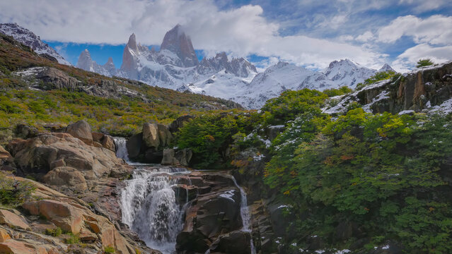 a view of secret waterfall and monte fitz roy on an autumn afternoon in los glaciares national park of patagonian argentina
