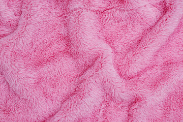 Pink plush fabric fills the frame with its raised pile and overlapping folds © Fleuronica