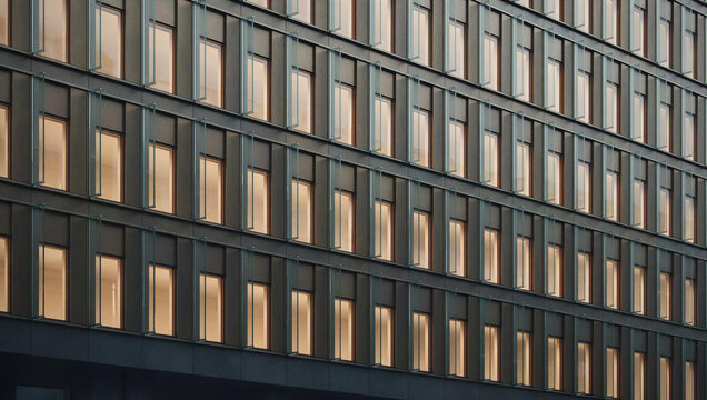 Modern Office Building Facade with Illuminated Windows