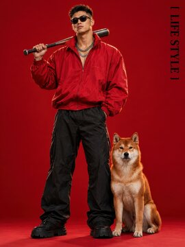 Street style fashion featuring a man holding a baseball bat dog