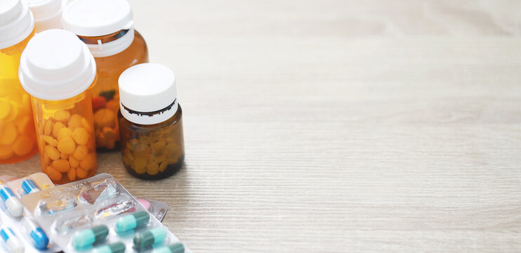 Pill bottle. colorful pills capsule on to surface tablets. drug medical healthcare pharmacy concept. pharmaceuticals antibiotics medicine in blister packs.