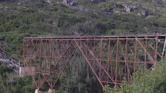 a close up shot of dead horse gulch bridge from the white pass train near skagway, alaska of the usa