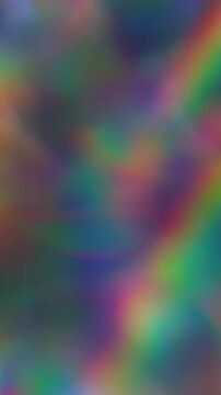 Vertical video. Blur prism light. Holographic flare. Colorful kaleidoscopic beam crystal reflection. Fluorescent rainbow twinkle abstract background.