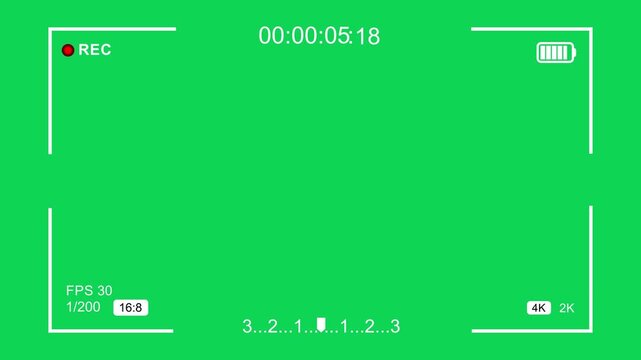Camera recording overlay interface with green screen background, featuring real-time digital timecode, battery indicator, focus frame, and cinematic 4 k resolution settings for creative editing