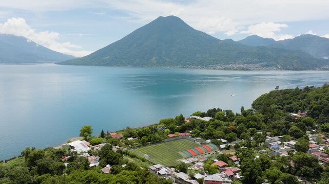 Establishing drone shot overlooking the Panajachel village and Lake Atitlan