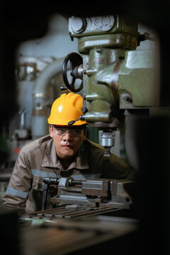 Technical engineer workers working in control room plant at industry factory to service maintenance on engineering machine, production technician occupation in global industrial business concept