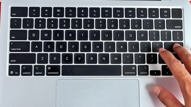 Asian man hand pusing keyboard modern laptop keys