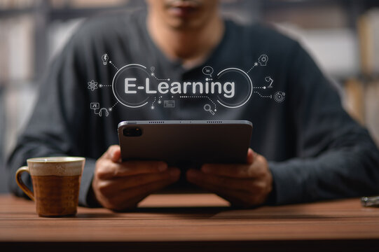 Young Person Using Digital Tablet for E-Learning in Modern Setting