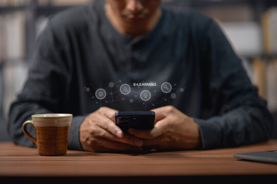 Person Engaged in E-Learning Using Smartphone at Desk with Coffee
