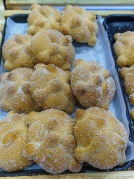 Tray Filled with Traditional Mexican Pan de Muerto in a Bakery