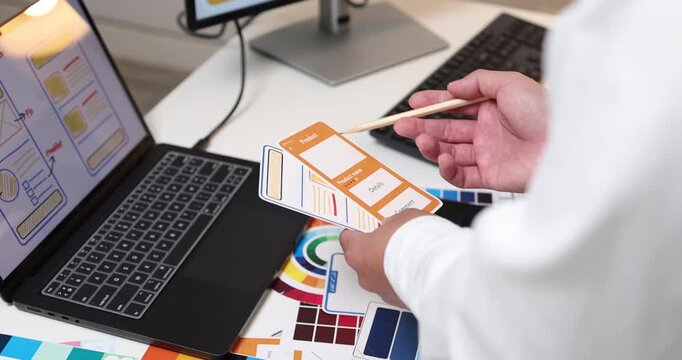 UX UI design and user experience development, featuring creative professionals collaborating on interface layouts, reviewing design prototypes, and refining visual elements to create intuitive.