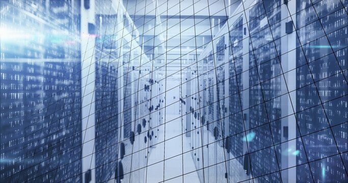Camera capturing central aisle at data center, showing server racks, LED lights, binary streams