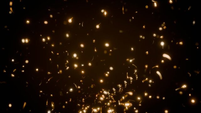 Gold confetti and streamers bursting upward with bokeh on black