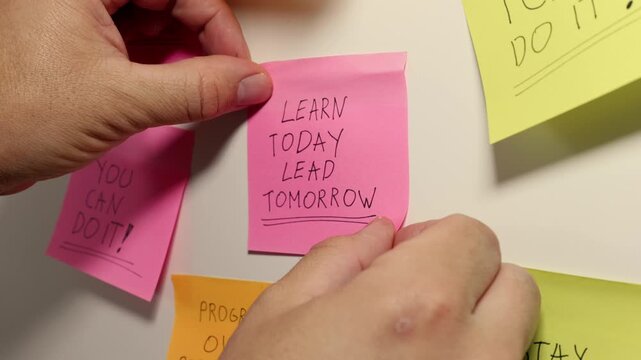 LEARN TODAY LEAD TOMORROW Message on a Pink Sticky Note