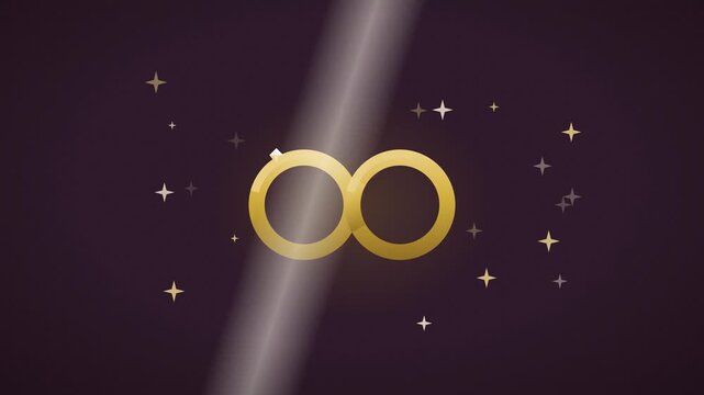 Two interlocking gold wedding rings with a diamond and light sweep