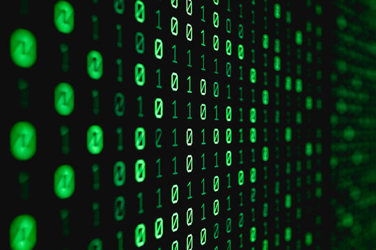 Glowing green binary code streams, forming a digital abstract visual representing data transmission and computing technology.