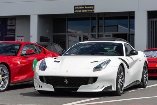 N&uuml;rburg, Germany - July 6th 2019 : View on a white Ferrari F12tdf finished in Bianco Avus parked on a street.