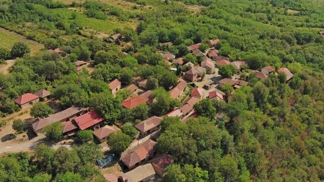 Aerial around view of old rustic vintage houses with wine cellars in Rogljevacke pivnice in Negotin region of Serbia, 4k
