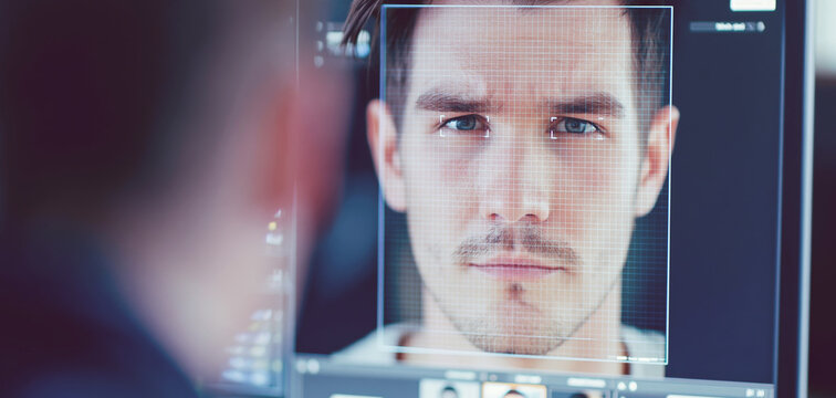 Facial recognition system scanning a man's face with biometric tracking points for digital identity verification and security
