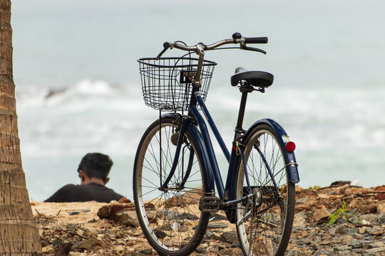 A blue bicycle with a basket on the front