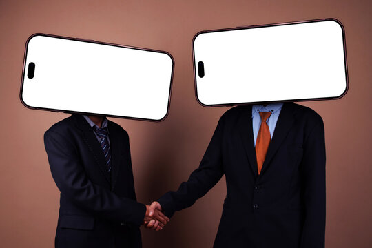 Two Businessmen Shaking Hands with Blank Smartphone Screens Replacing Their Heads