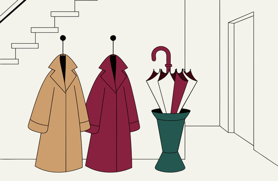 Drying coats and umbrella after a rainy walk in home hallway, autumn clothing and wet weather accessories arranged indoors for practical seasonal care