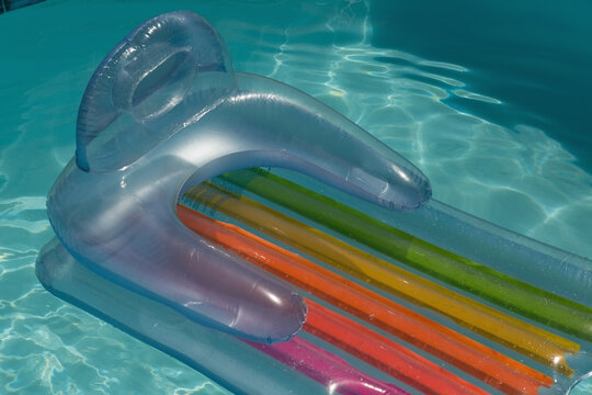 Inflatable tube floating in a swimming pool