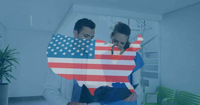 Image of usa map with flag over caucasian female and male doctors talking on corridor