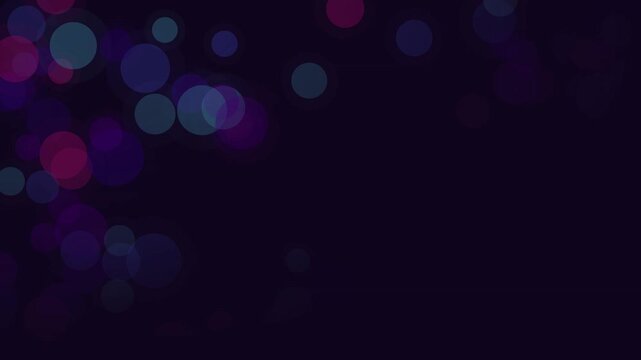 Soft purple and blue bokeh circles drift across a dark background for abstract video overlays.