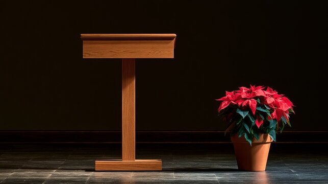 A wooden podium stands beside a vibrant poinsettia plant in a terracotta pot, symbolizing Christmas traditions and festive holiday celebrations with a warm glow.