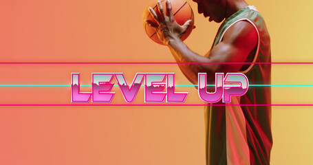 Image of level up text over basketball player on neon background © vectorfusionart