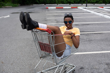 Playful shopping cart adventure outdoors. © Rawpixel.com
