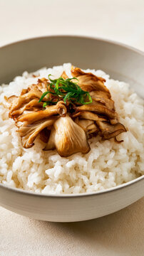 Savory Rice Bowl Topped with Fried Maitake Mushrooms and Green Onion Garnish