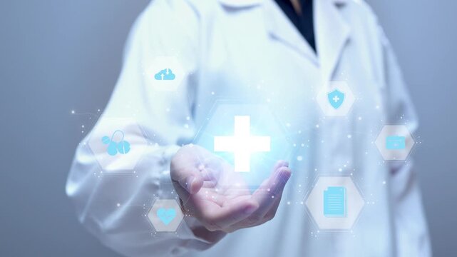 Medical doctor presenting glowing holographic healthcare interface icons on palm for telemedicine technology concept