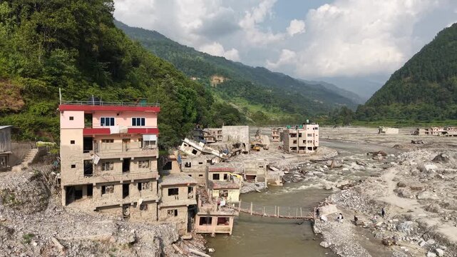Aerial footage captures house ruins and a new river channel created when the devastating Rasuwa flood altered the river&rsquo;s course, leaving the surrounding landscape transformed.