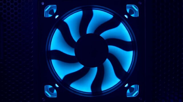Computer cooling fan spinning rapidly with glowing purple and blue LED lights inside desktop system case