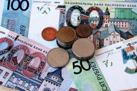 Belarusian ruble money notes and coins on table. Belarus cash bills of BYN currency close up