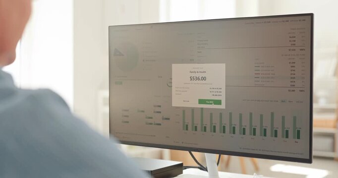 Man completes payment for household bill online. Footage shows a budget dashboard as payment confirmation appears, showing expense tracking. Household finance management made simple today.