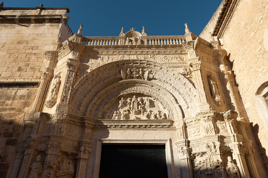 Plaza de la Constituci&oacute;n with the Church of Our Lady of the Assumption in Biar, Alicante (Spain), bathed in morning light