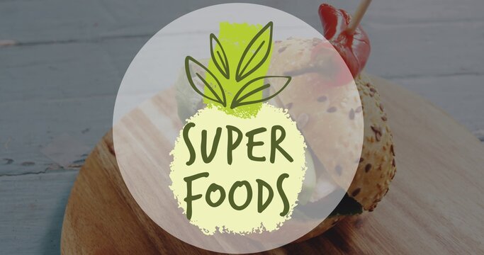 Displaying semiopaque badge over sesame slider on cutting board at cafe tabletop