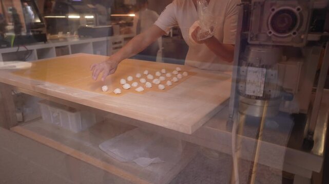 View of hand made soft pasta creating and display in shop window, Bologna, Emilia-Romagna, Italy