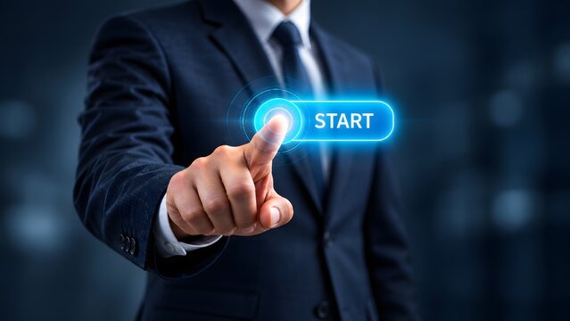 A business person in a formal suit pressing a glowing virtual start button on a digital interface representing the beginning of a new project or future technology.