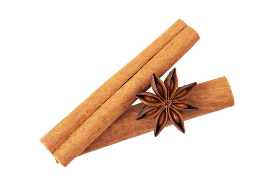 Cinnamon sticks with star anise seeds isolated on white background