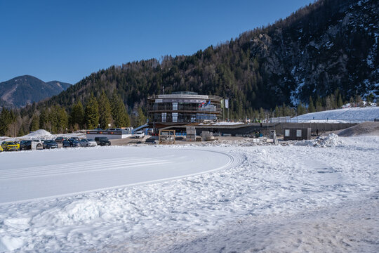 Planica, Slovenia - March 6, 2026: Planica Nordic Centre with Planica museum pavilion against blue sky in winter