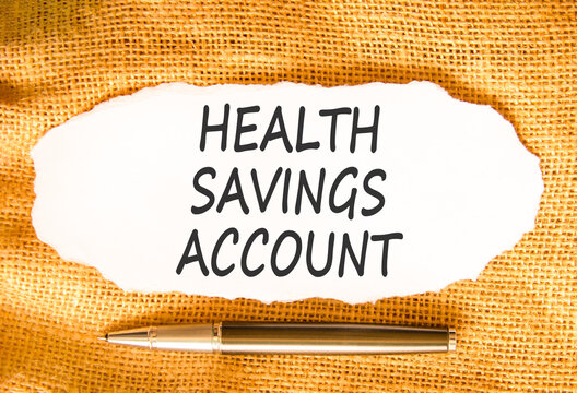 Health saving account symbol. Concept words Health saving account on beautiful white paper. Beautiful canvas background. Black pen. Medical Health saving account concept. Copy space.